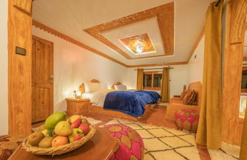 Ein Bett oder Betten in einem Zimmer der Unterkunft Hotel Riad Bahammou