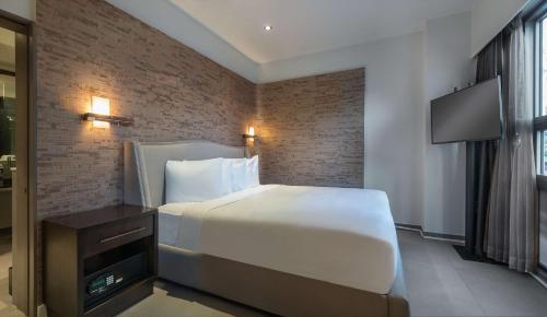 a hotel room with a bed and a television at Hyatt Herald Square New York in New York