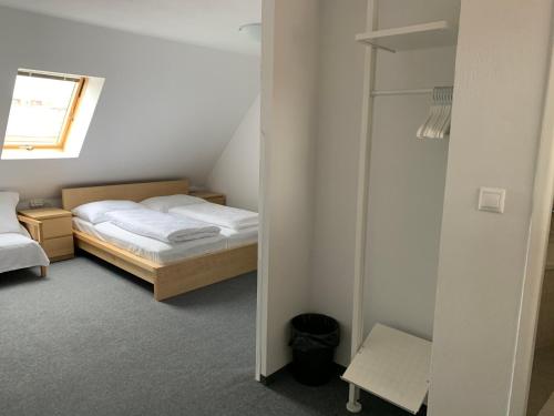 Кровать или кровати в номере Penzion Holiday