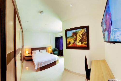 A bed or beds in a room at Hotel Campestre El Cisne
