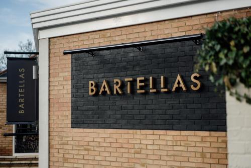 a barlished sign on the side of a brick building at Ivy Hill Hotel, Sure Hotel Collection by Best Western in Chelmsford