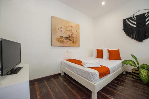 Katil atau katil-katil dalam bilik di Hotel Caracol Puerto Morelos