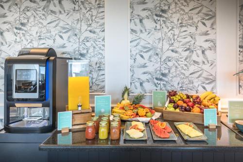 a buffet with a variety of fruits and vegetables at Barceló Aracena & Spa in Aracena