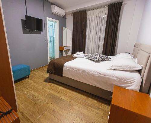 Cama o camas de una habitación en Olivar Hotel Tirana