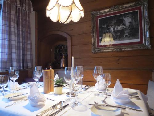 a table with wine glasses and napkins on it at Kertess in Sankt Anton am Arlberg