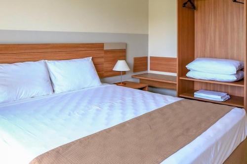 Lova arba lovos apgyvendinimo įstaigoje Ilhas do Lago Eco Resort - Apartamento