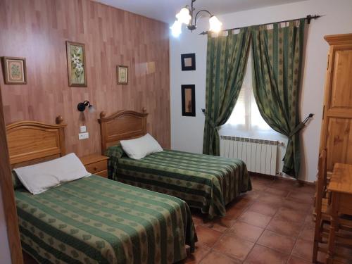 Postel nebo postele na pokoji v ubytování Casa Rural IRIS