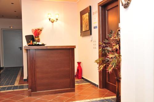 a hallway with a wooden door in a building at Hotel Gogos in Kalabaka