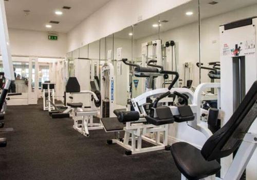 a gym with a bunch of treadms and machines at The Dunraven, Adare in Adare