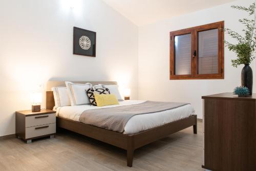 מיטה או מיטות בחדר ב-la Maison du Soleil