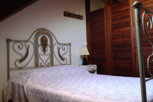 a bedroom with a bed with a white bedspread at Beach House - Tavira Island in Tavira