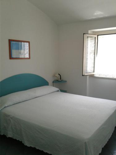 Ένα ή περισσότερα κρεβάτια σε δωμάτιο στο Borgo Antico