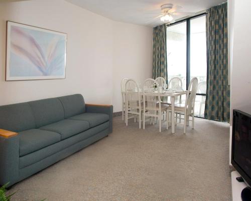 a living room with a couch and a table at Lotus Inn in Wildwood Crest