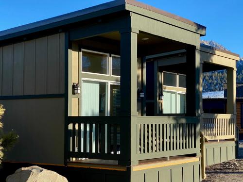 a house with a screened in porch on top of it at Sierra Meadows Ranch in Mammoth Lakes