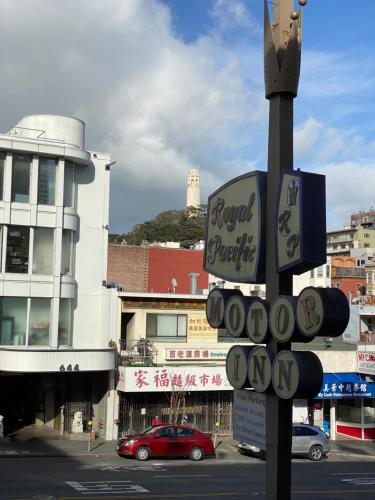 a street sign on a pole in a city at Royal Pacific Motor Inn in San Francisco