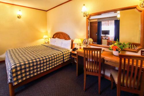 Säng eller sängar i ett rum på Hotel Lastra