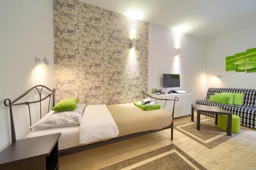Posteľ alebo postele v izbe v ubytovaní Logo apartments 5 min walk to main square