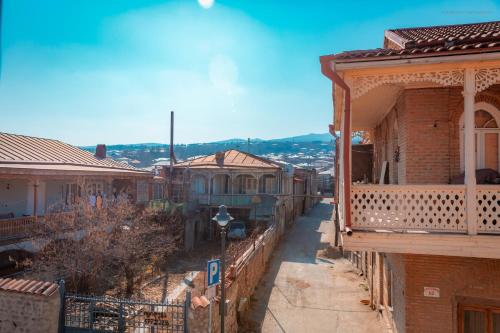 an empty street in a town with houses at Dzveli Galavani -Old Wall in Telavi