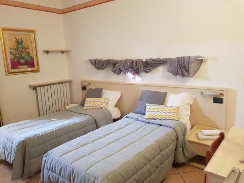 Ένα ή περισσότερα κρεβάτια σε δωμάτιο στο Cavallo Bianco