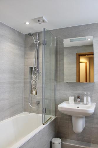 a bathroom with a sink and a shower at Endcliffe in Falmouth
