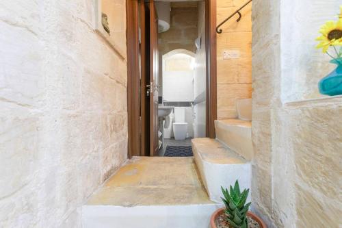 a hallway of a house with a door and a plant at La Casetta in St. Paul's Bay