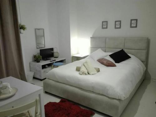 Ένα ή περισσότερα κρεβάτια σε δωμάτιο στο CKBSM Central Square Apartment Kalamata