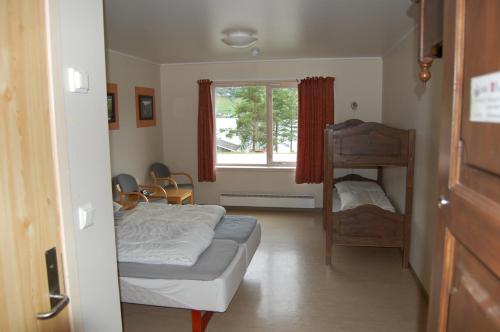 Ένα ή περισσότερα κρεβάτια σε δωμάτιο στο Lyngmo Gjestehus