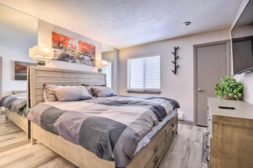 a bedroom with a large bed in a room at Brian Head Ski-InandSki-Out Condo with Resort Perks! in Brian Head