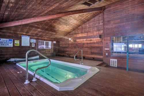 a jacuzzi tub in a room with wooden walls at Brian Head Ski-InandSki-Out Condo with Resort Perks! in Brian Head