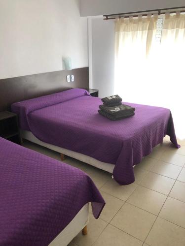Ένα ή περισσότερα κρεβάτια σε δωμάτιο στο Hotel Nilmar