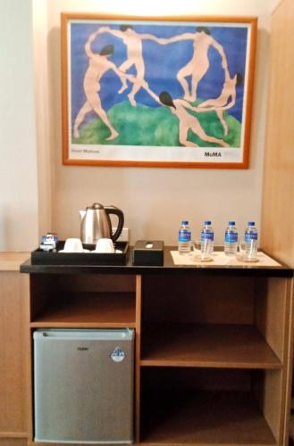a room with a desk with water bottles at Ciabel Hotel and Fitness Center in San Juan
