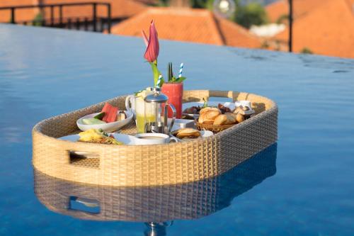 a basket filled with food on a table at Sevn Legian in Legian