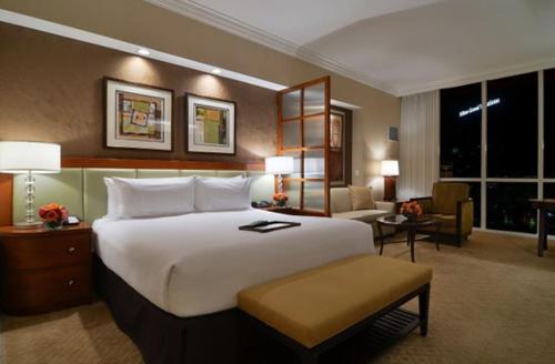 A bed or beds in a room at The Signature at MGM Grand by Suiteness