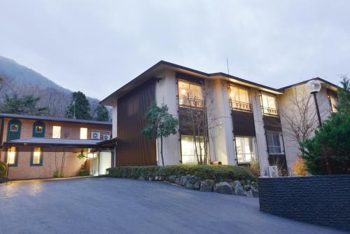 a large house with a driveway in front of it at HESTA Hakone - GUEST HOUSE - in Hakone
