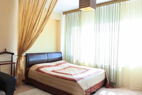 Кровать или кровати в номере Vip House Hotel