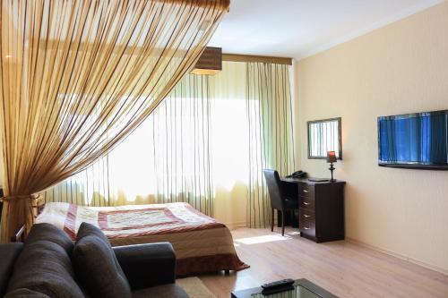 Телевизор и/или развлекательный центр в Vip House Hotel