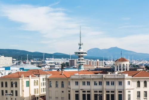 a view of a city with buildings and a tower at #Mary Rose Apt by halu! Apartments in Thessaloniki