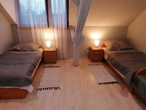 Postel nebo postele na pokoji v ubytování Agroturystyka Siedlisko pod dębami