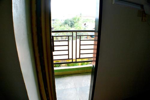 a view of a balcony from an open door at Rufina's Leisure Center in Tagum