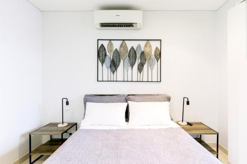 Кровать или кровати в номере Darwin City Chic@Kube Apartments