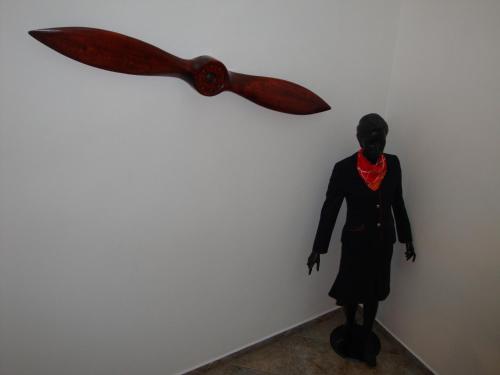 a statue of a woman with a knife on a wall at Penzion Aviatik in Čáslav