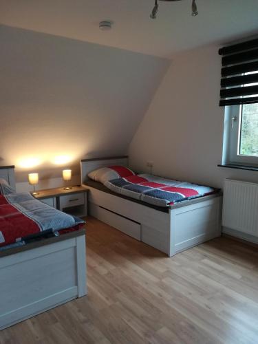 a bedroom with two beds in a attic at bei Maria + Kalle in Schortens
