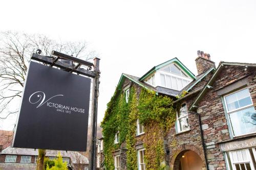 a sign in front of a building at Victorian House in Grasmere