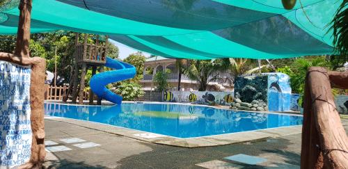 a pool at a resort with a water park at Seasun Beach Resort & Hotel in Santa Cruz