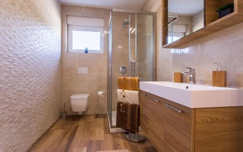 Ванная комната в Waterfront Apartments Pia - Marija