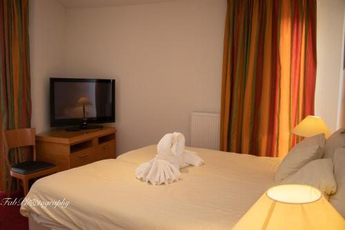 Katil atau katil-katil dalam bilik di Hotel 2000 Valkenburg