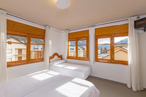 Postel nebo postele na pokoji v ubytování Hostal Trainera