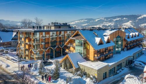 an aerial view of a building in the snow at Hotel Wersal in Zakopane
