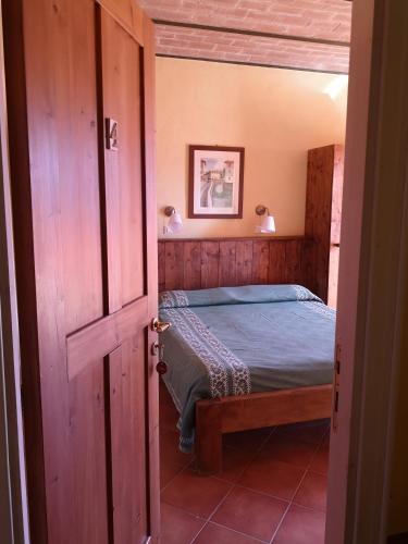 Ένα ή περισσότερα κρεβάτια σε δωμάτιο στο Agriturismo Olimpo