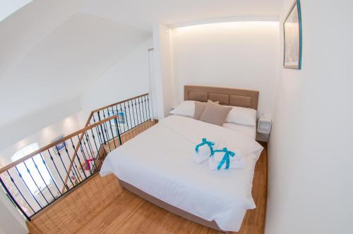 Posteľ alebo postele v izbe v ubytovaní Bazzar Apartments